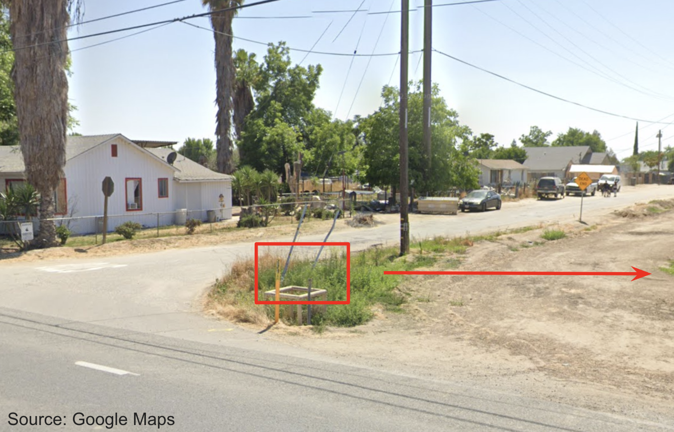 Photo of a suburban street in Kern County. A red box is overlayed over the site of a gas leak. 